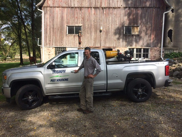 Triumph Pest Solutions owner with service truck